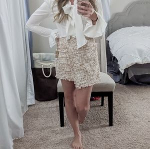 Light pink asymmetrical tweed mini skirt